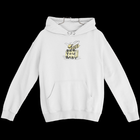 white graphic hoodie with a graphic on the top front of a bee smiling carrying luggage with the words "bee you baby" on top.